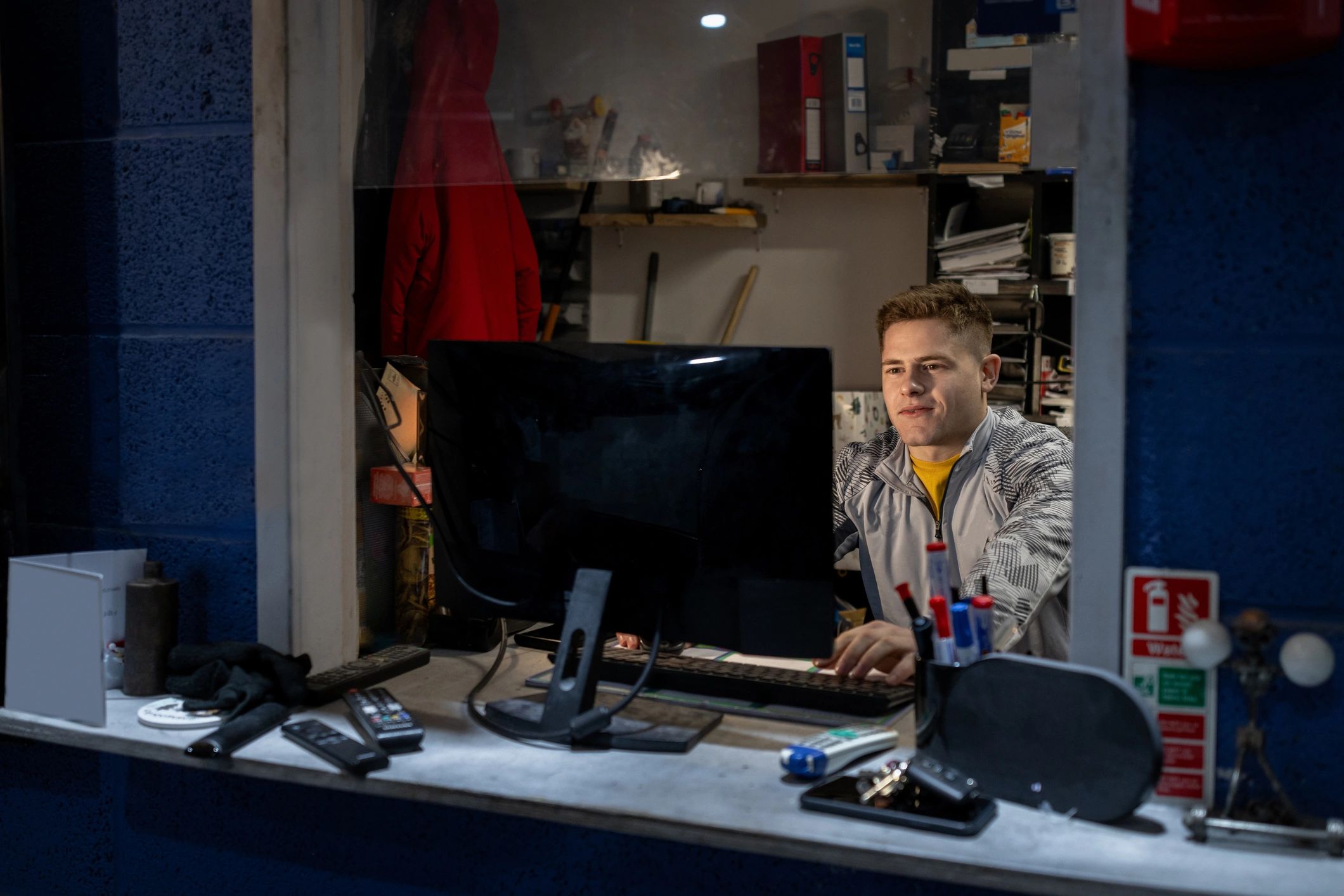 Neon-lit gamer at a keyboard and mouse setup